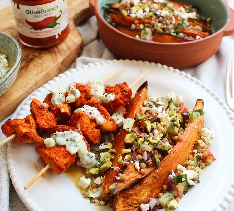 Chicken, red pepper and chilli skewers with giant couscous ‘tabbouleh’ loaded sweet potato wedges, homemade tzatziki and crumbled pistachios